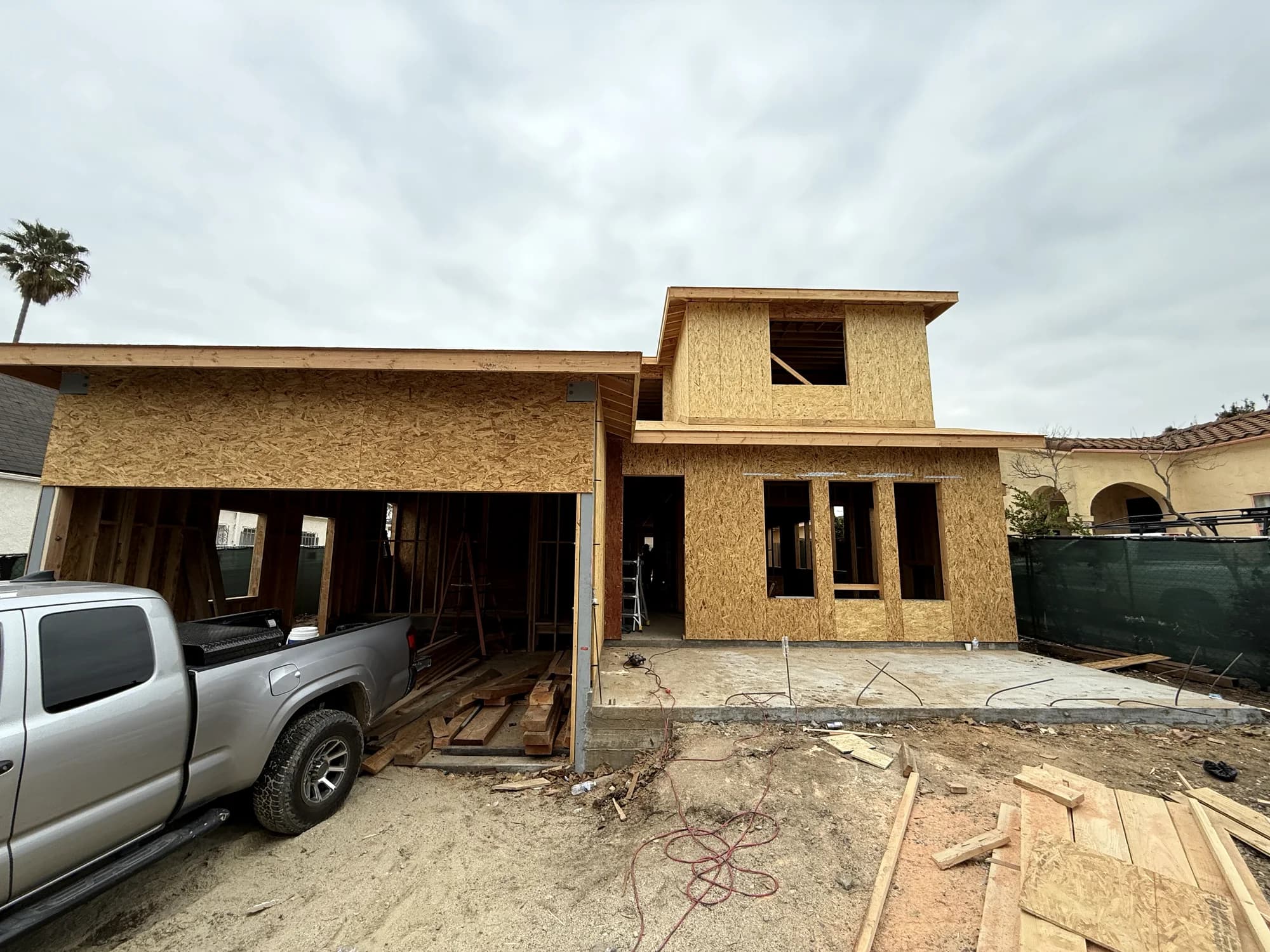 Framing underway on a hillside lot