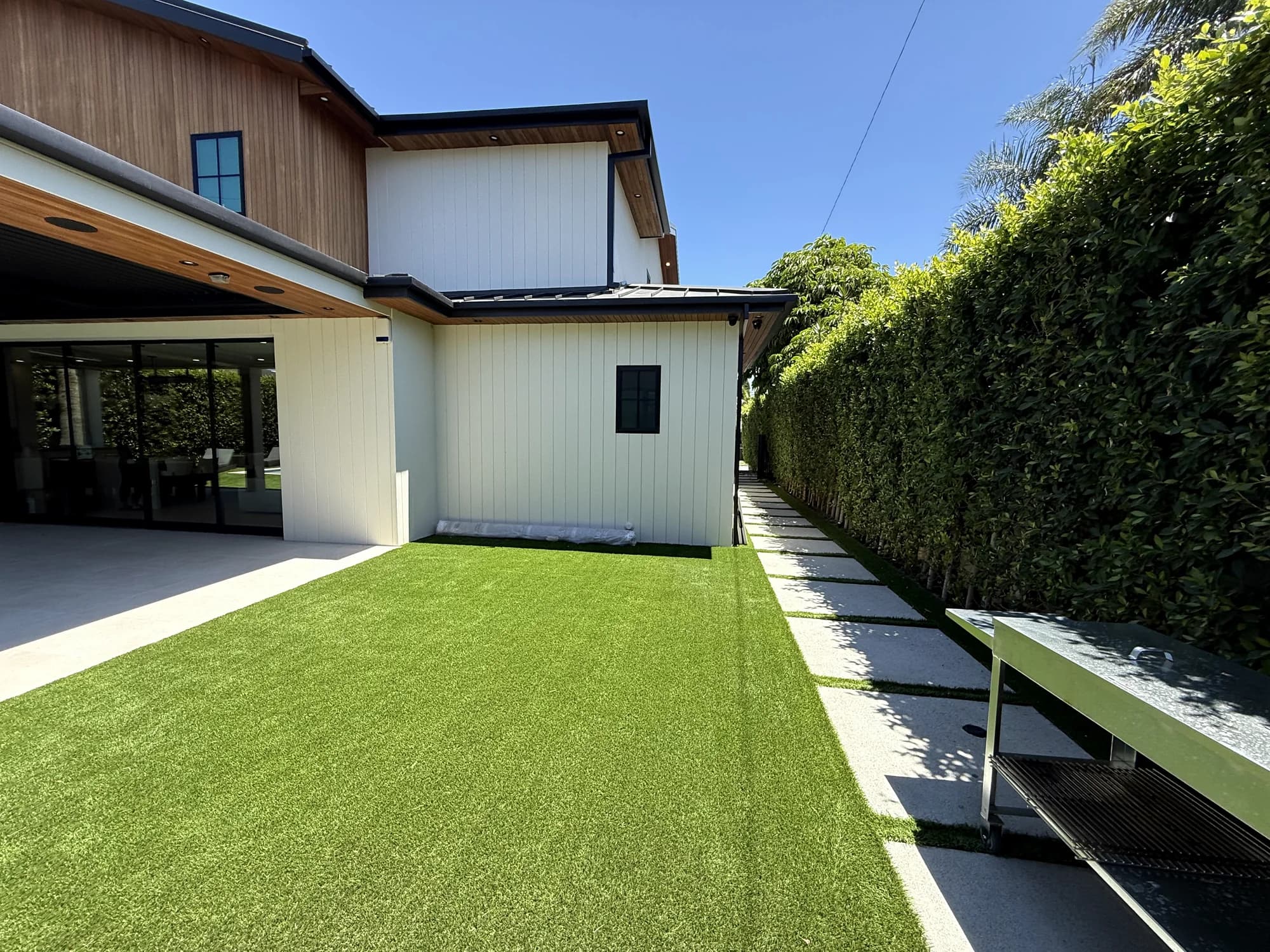 Finished exterior with landscaped side yard